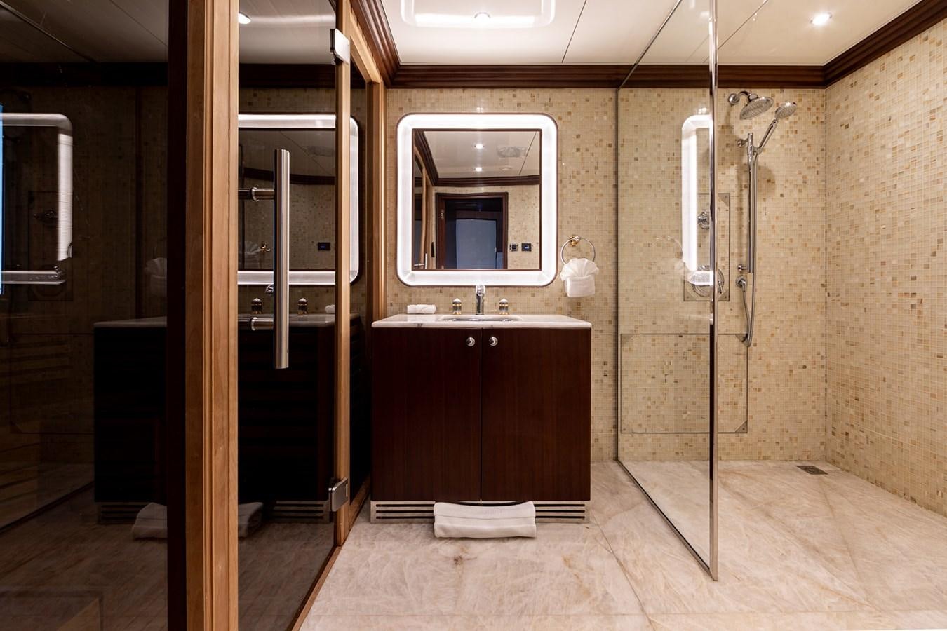 a bathroom with a sink and a mirror aboard QUEEN MAVIA Yacht for Sale