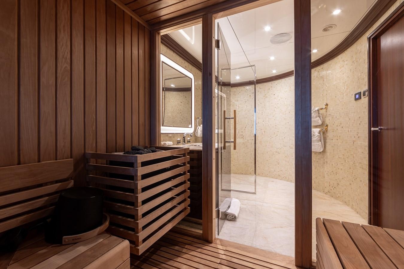 a room with a wood floor and a wood staircase aboard QUEEN MAVIA Yacht for Sale