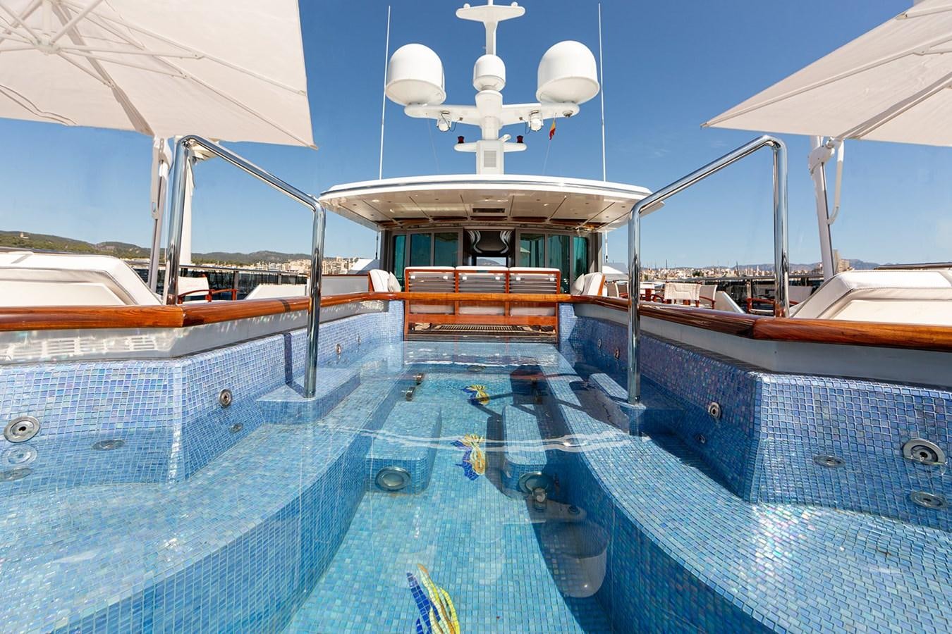 a large boat with a large white lamp on the deck aboard QUEEN MAVIA Yacht for Sale