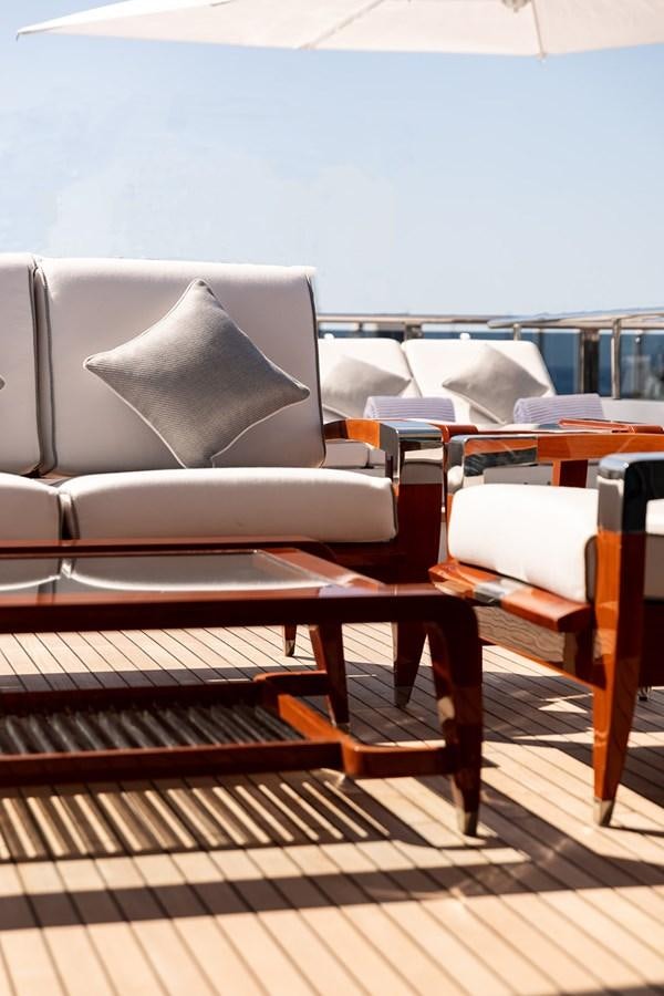 a couch in a room aboard QUEEN MAVIA Yacht for Sale