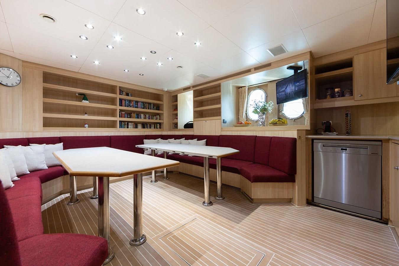 a kitchen and dining area aboard QUEEN MAVIA Yacht for Sale