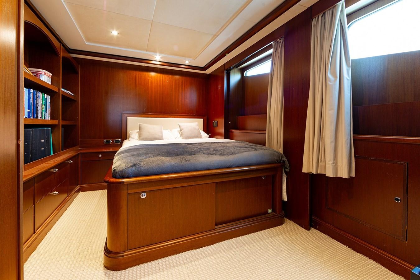 a bed in a room aboard QUEEN MAVIA Yacht for Sale