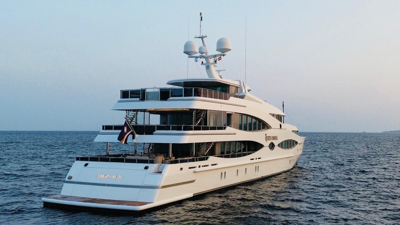 a large white boat in the water aboard QUEEN MAVIA Yacht for Sale