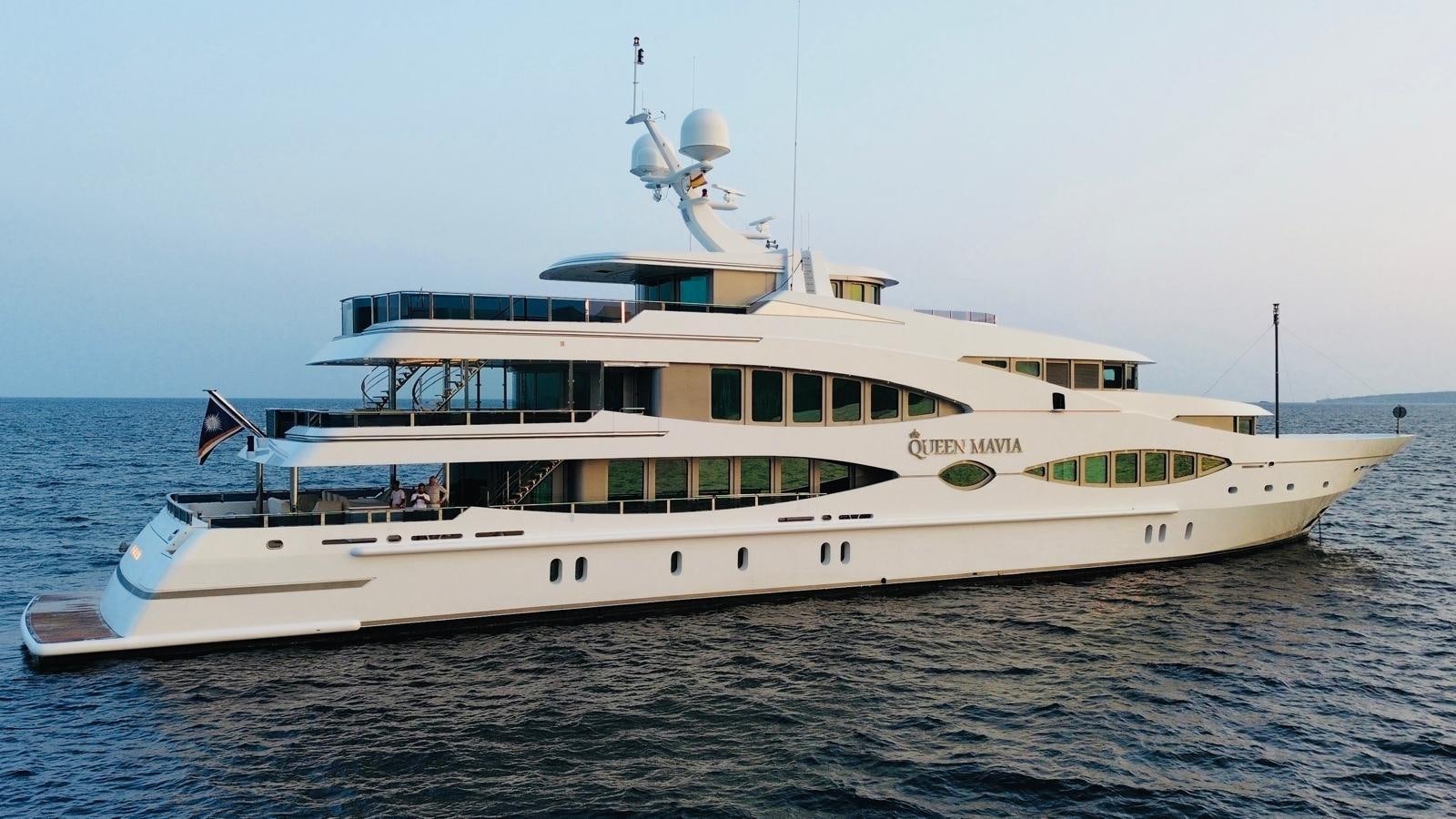 a large white ship in the water aboard QUEEN MAVIA Yacht for Sale