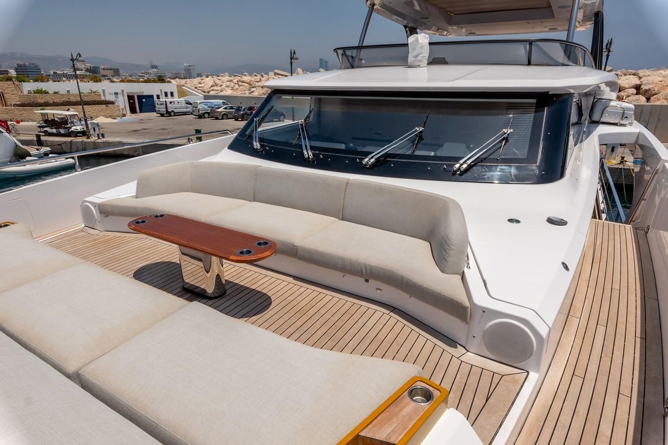 a white car on a road aboard AZIMUT GRANDE 26/25 Yacht for Sale