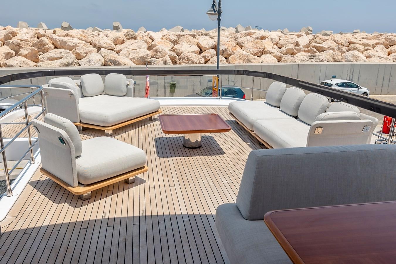 a deck with a deck and chairs aboard AZIMUT GRANDE 26/25 Yacht for Sale