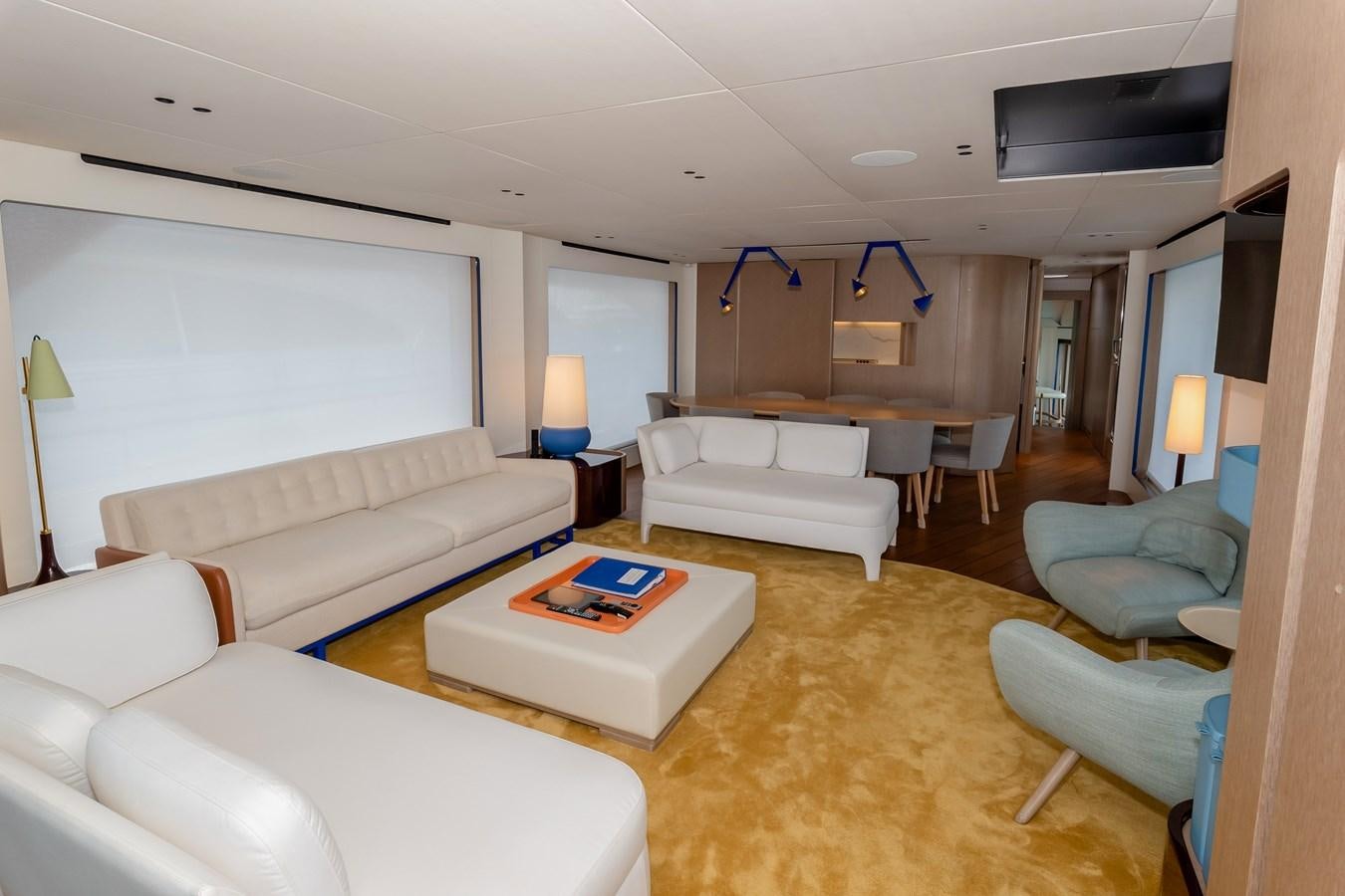 a living room with a large screen aboard AZIMUT GRANDE 26/25 Yacht for Sale