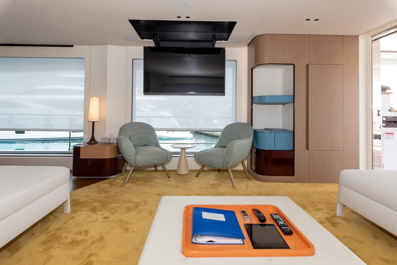 a living room with a table and chairs aboard AZIMUT GRANDE 26/25 Yacht for Sale