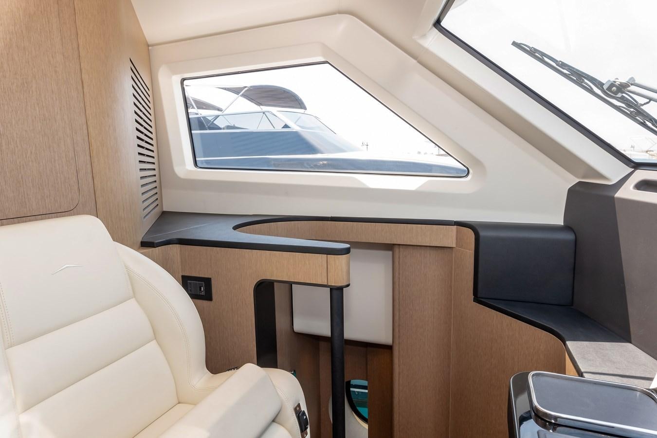 a room with a couch and a television aboard AZIMUT GRANDE 26/25 Yacht for Sale