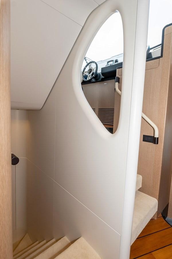 a white door with a mirror aboard AZIMUT GRANDE 26/25 Yacht for Sale