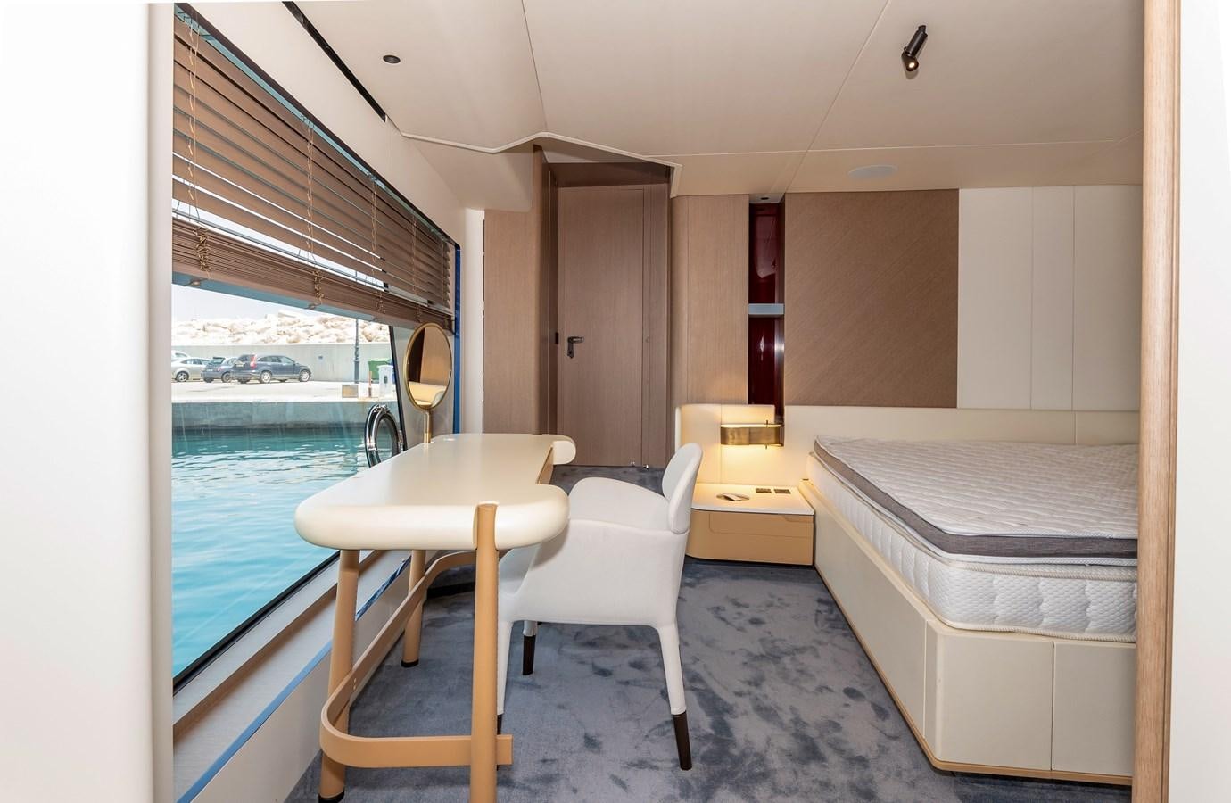 a room with a table and chairs aboard AZIMUT GRANDE 26/25 Yacht for Sale
