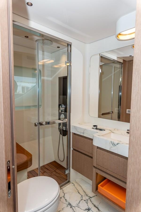 a bathroom with a glass shower aboard AZIMUT GRANDE 26/25 Yacht for Sale