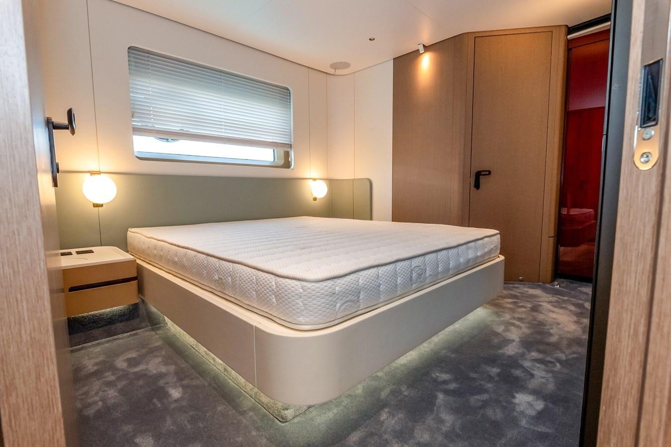 a bed in a room aboard AZIMUT GRANDE 26/25 Yacht for Sale