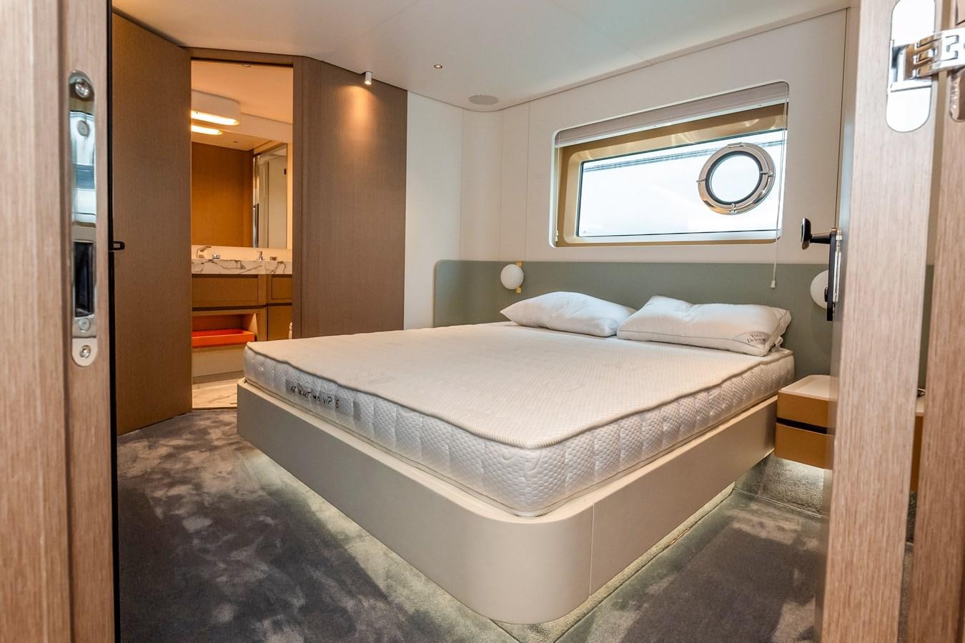 a bed in a room aboard AZIMUT GRANDE 26/25 Yacht for Sale