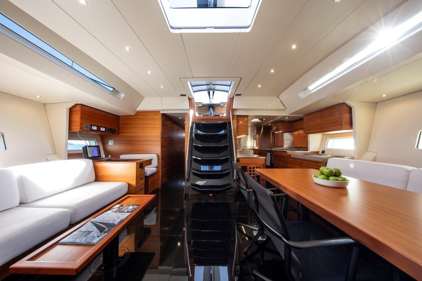 a ladder on a ladder in a room with a couch and a table aboard GALMA Yacht for Sale