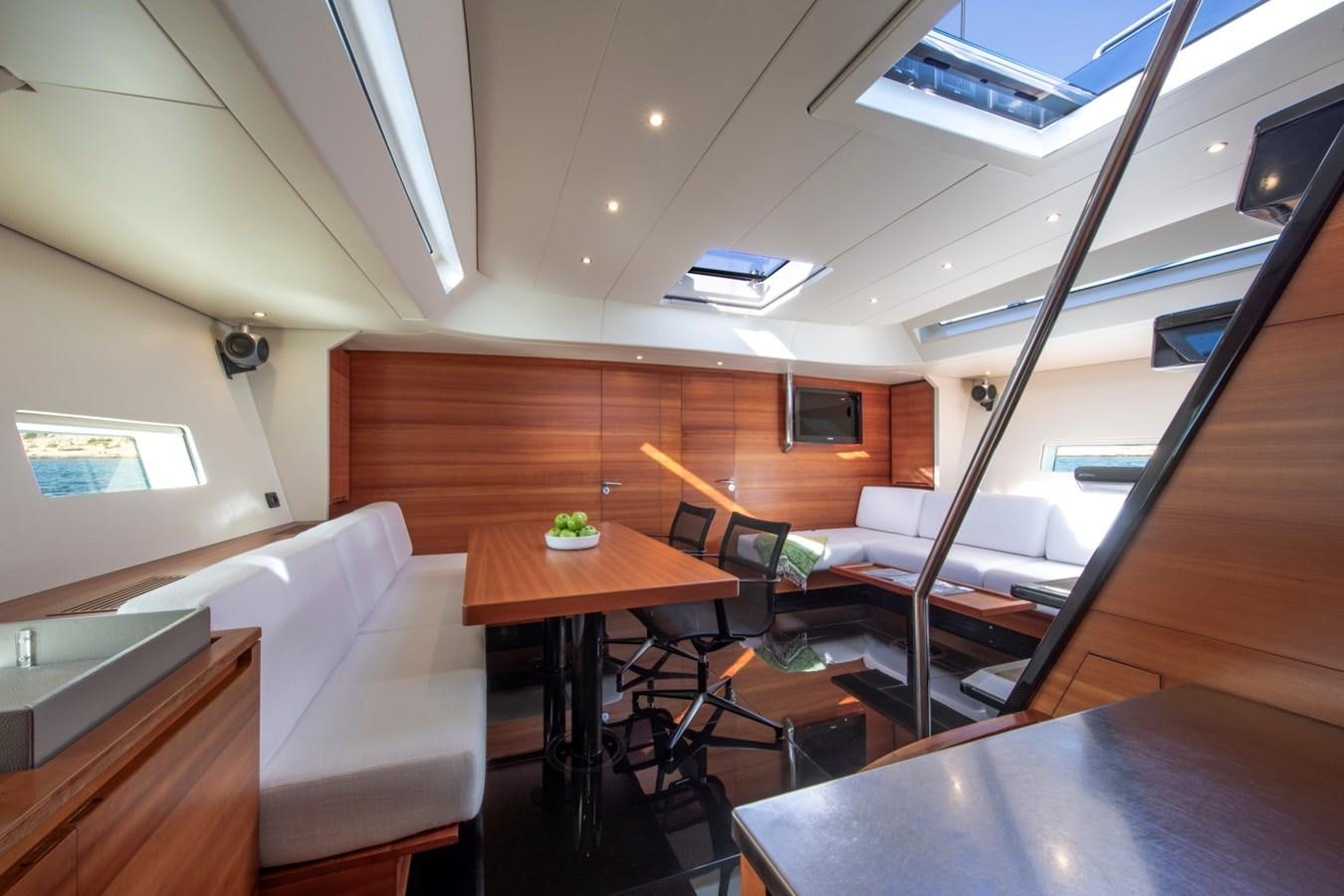 a room with a couch and a table aboard GALMA Yacht for Sale