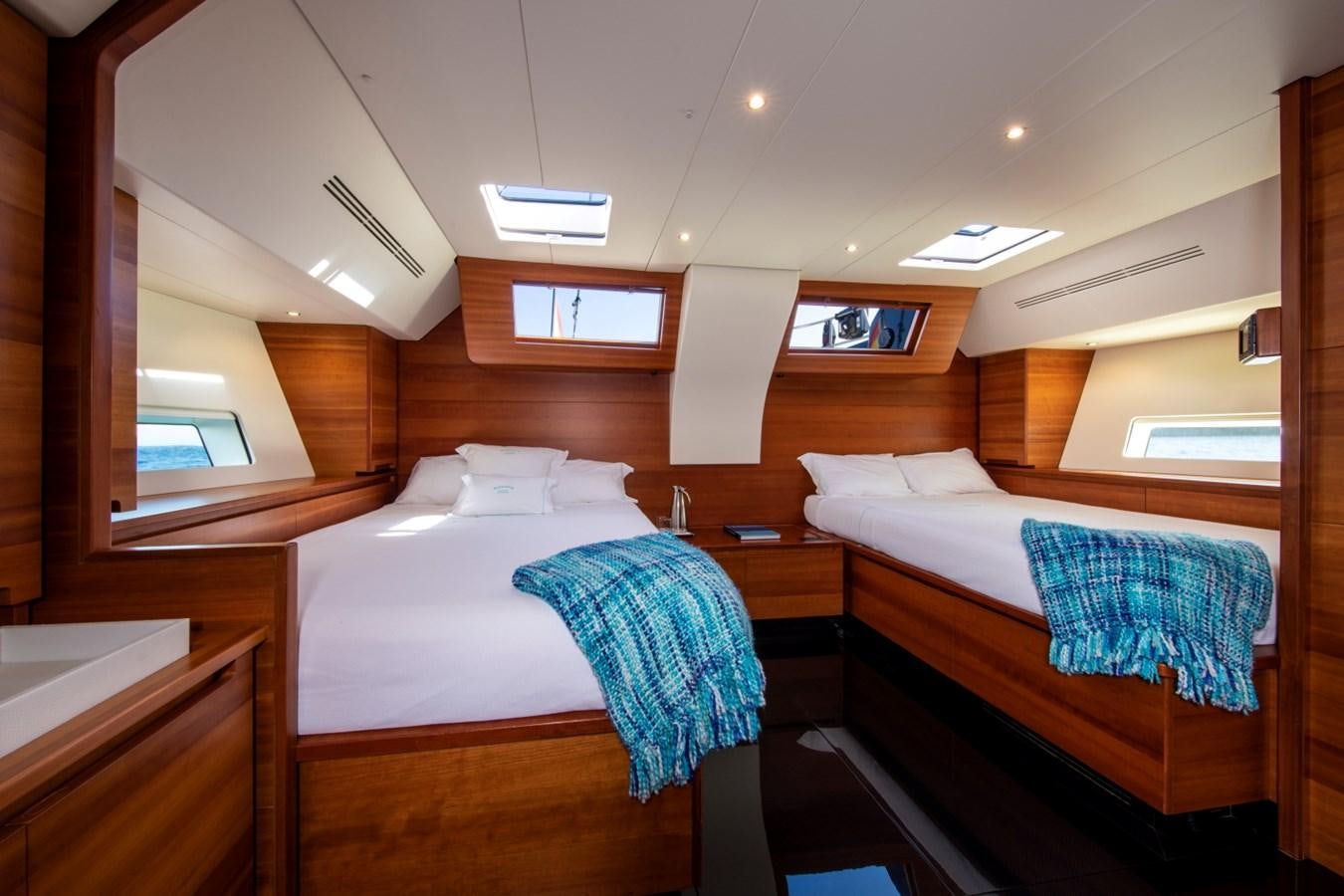 a room with two beds aboard GALMA Yacht for Sale