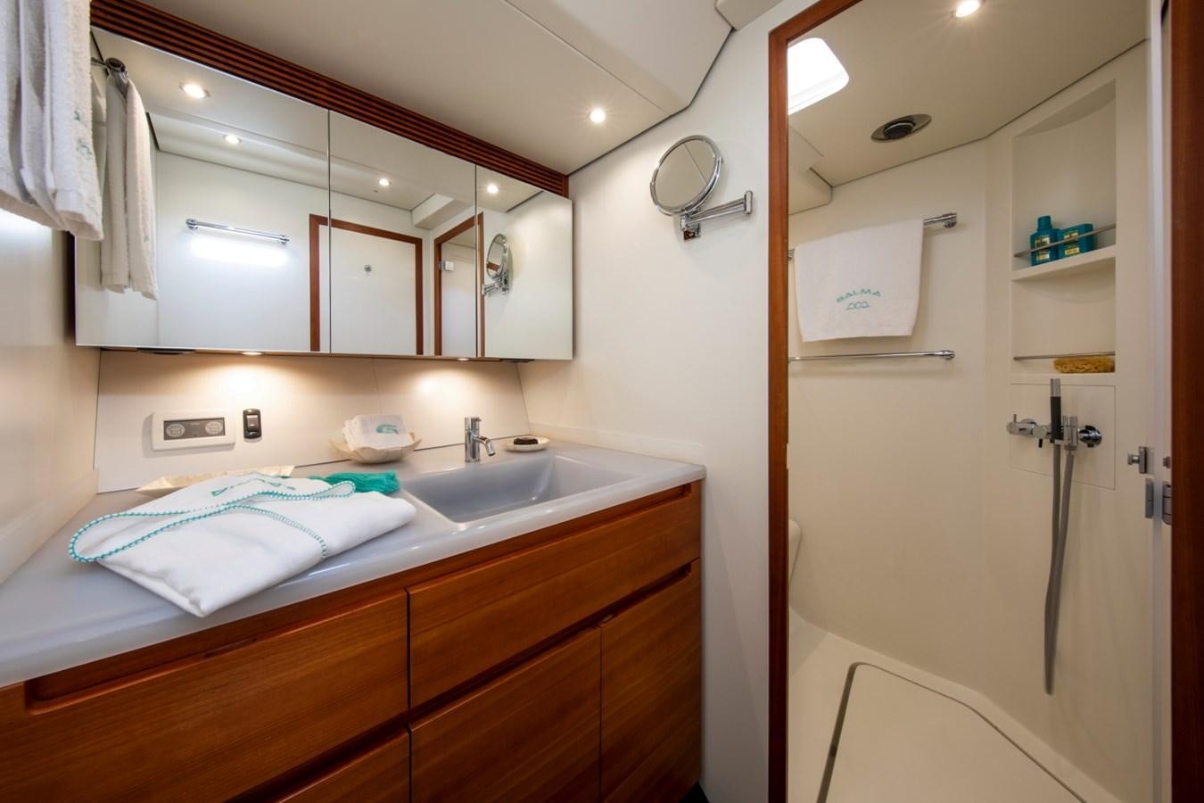 a bathroom with a sink and a mirror aboard GALMA Yacht for Sale