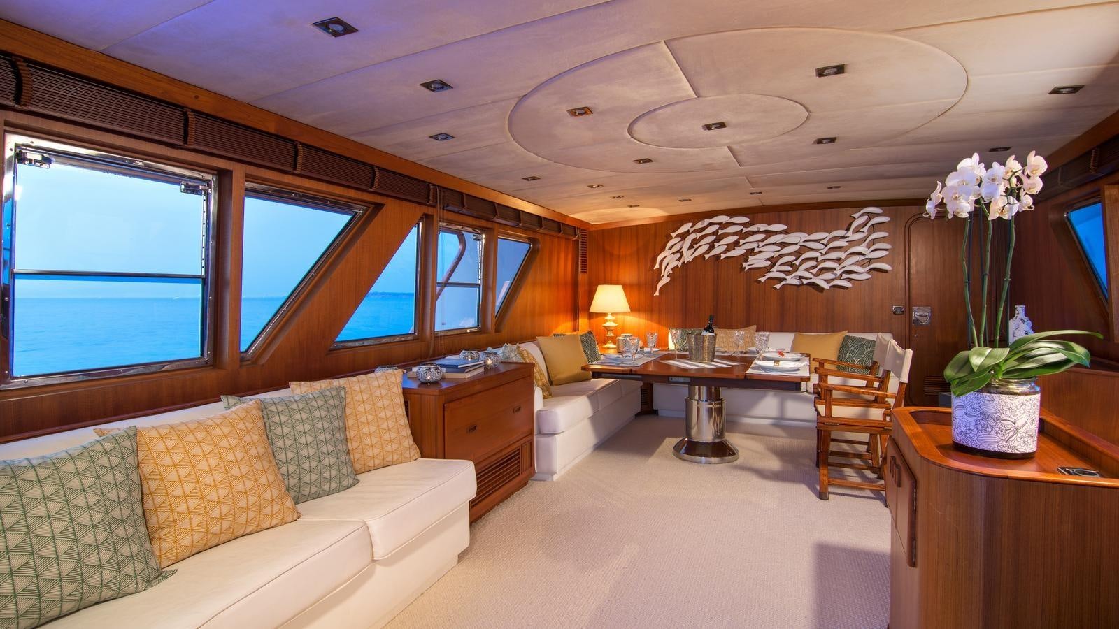 a living room with a couch and a table aboard OCEANE II Yacht for Sale