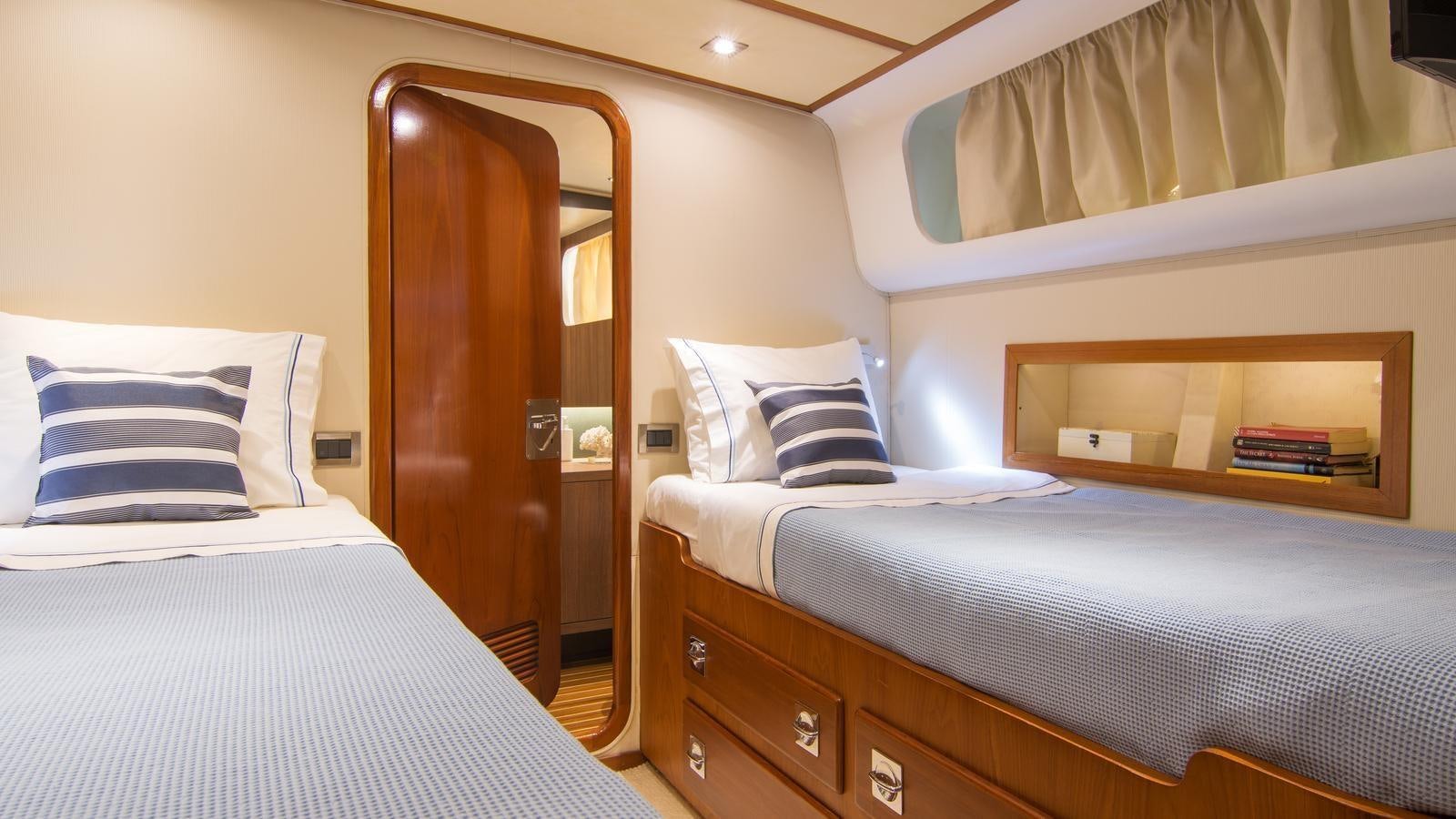 a room with two beds aboard OCEANE II Yacht for Sale