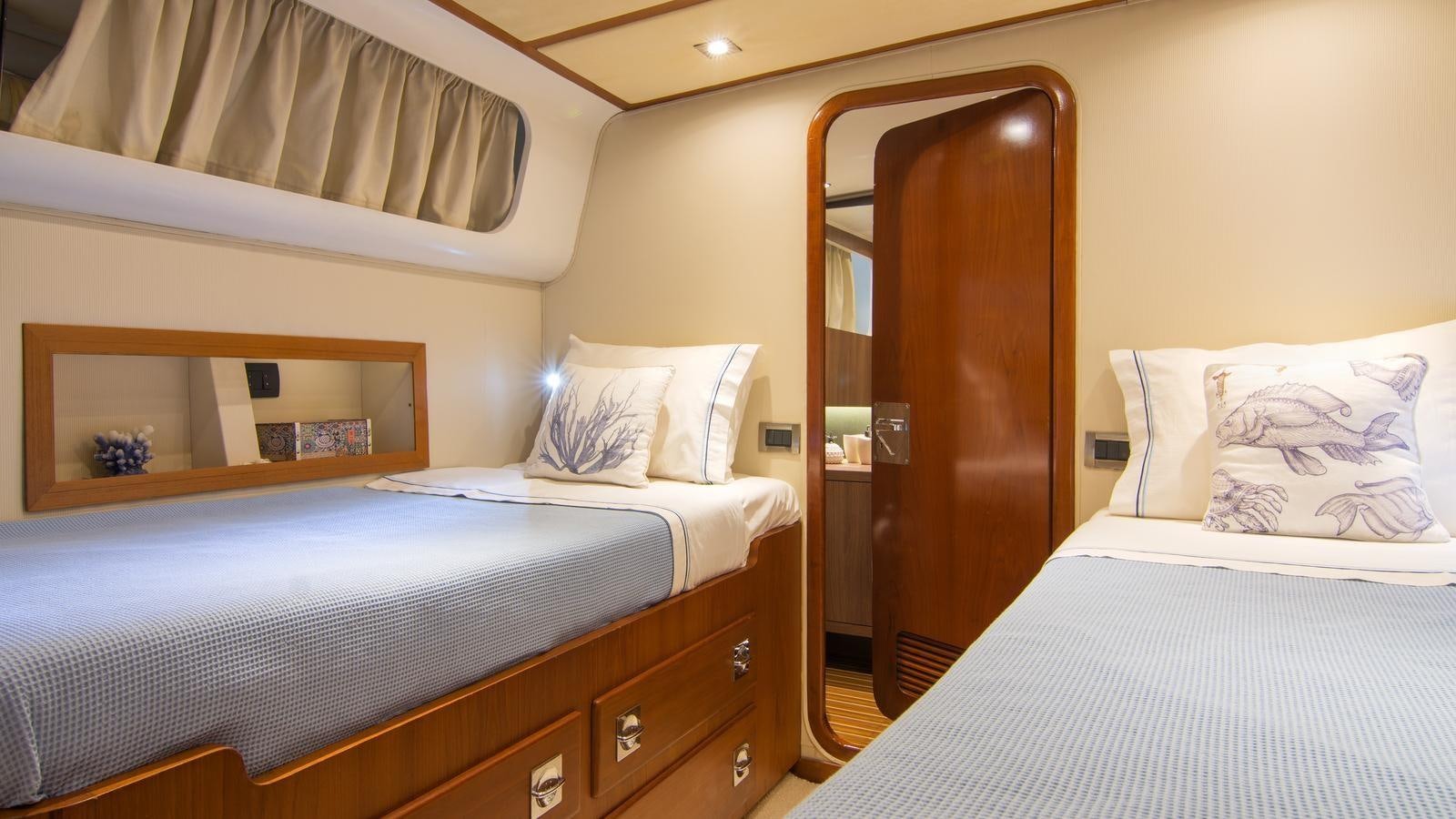 a room with two beds aboard OCEANE II Yacht for Sale