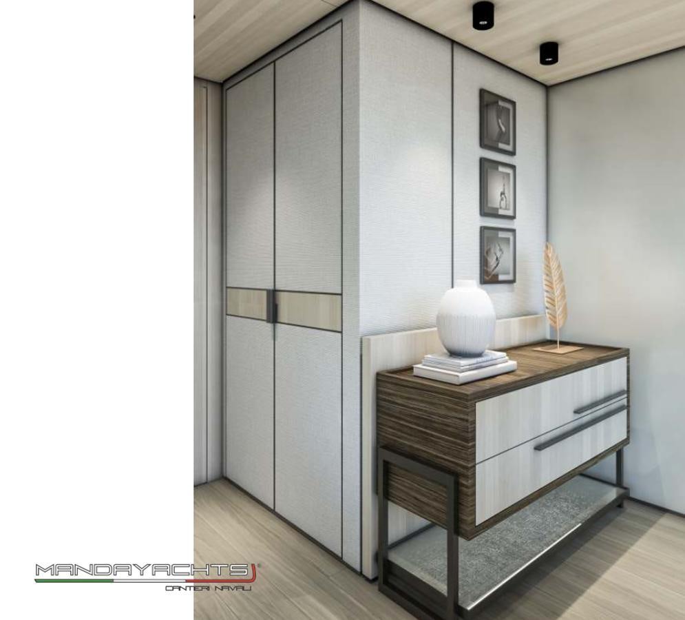 a room with a desk and a large wall with pictures on it aboard MANDA  S09 Yacht for Sale