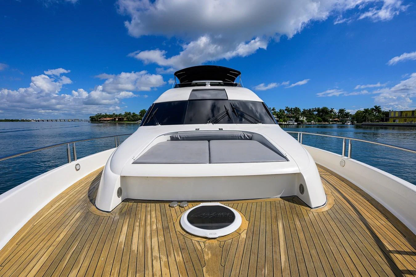 a white car on a wooden dock aboard LIVING THE DREAM Yacht for Sale