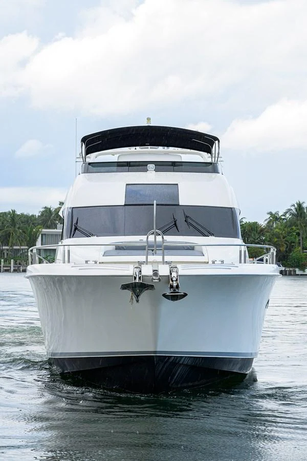a white yacht in the water aboard LIVING THE DREAM Yacht for Sale