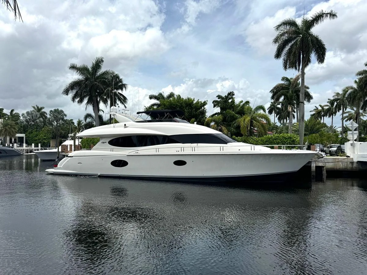 a white yacht in a body of water aboard LIVING THE DREAM Yacht for Sale