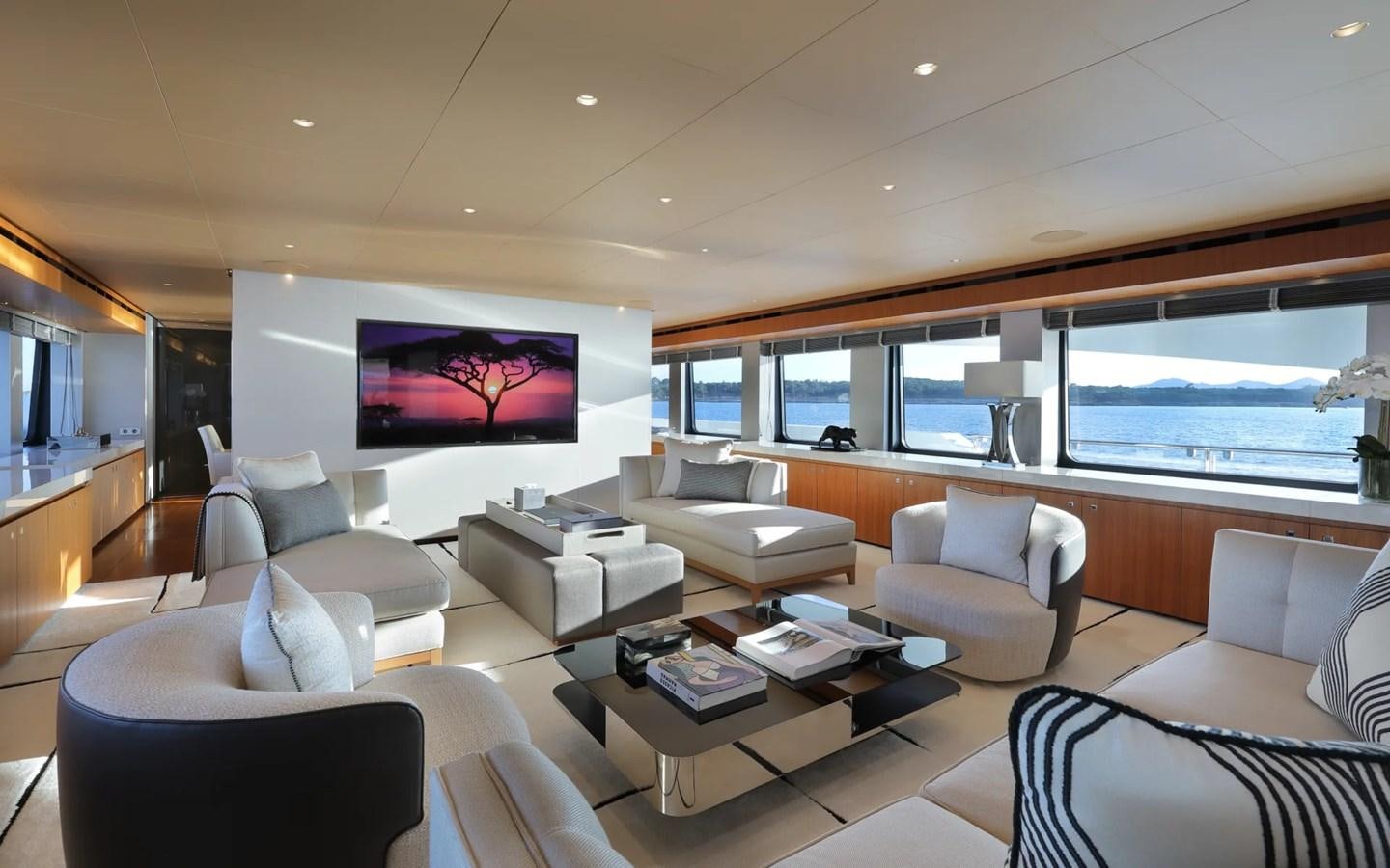 a living room with a large window aboard MADO Yacht for Sale