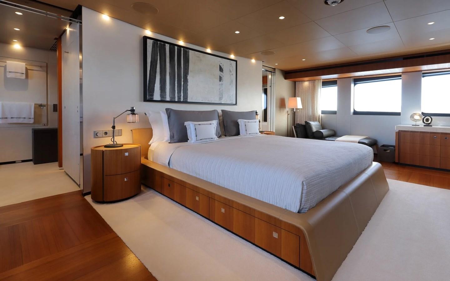 a large bedroom with a large bed aboard MADO Yacht for Sale