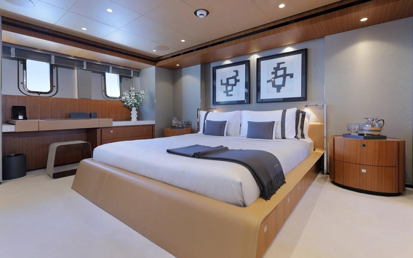 a large bedroom with a large bed aboard MADO Yacht for Sale
