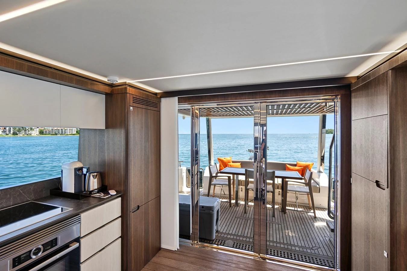 a kitchen with a sliding glass door aboard SMILE Yacht for Sale