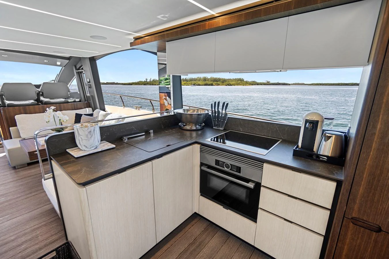 a kitchen with a large window aboard SMILE Yacht for Sale
