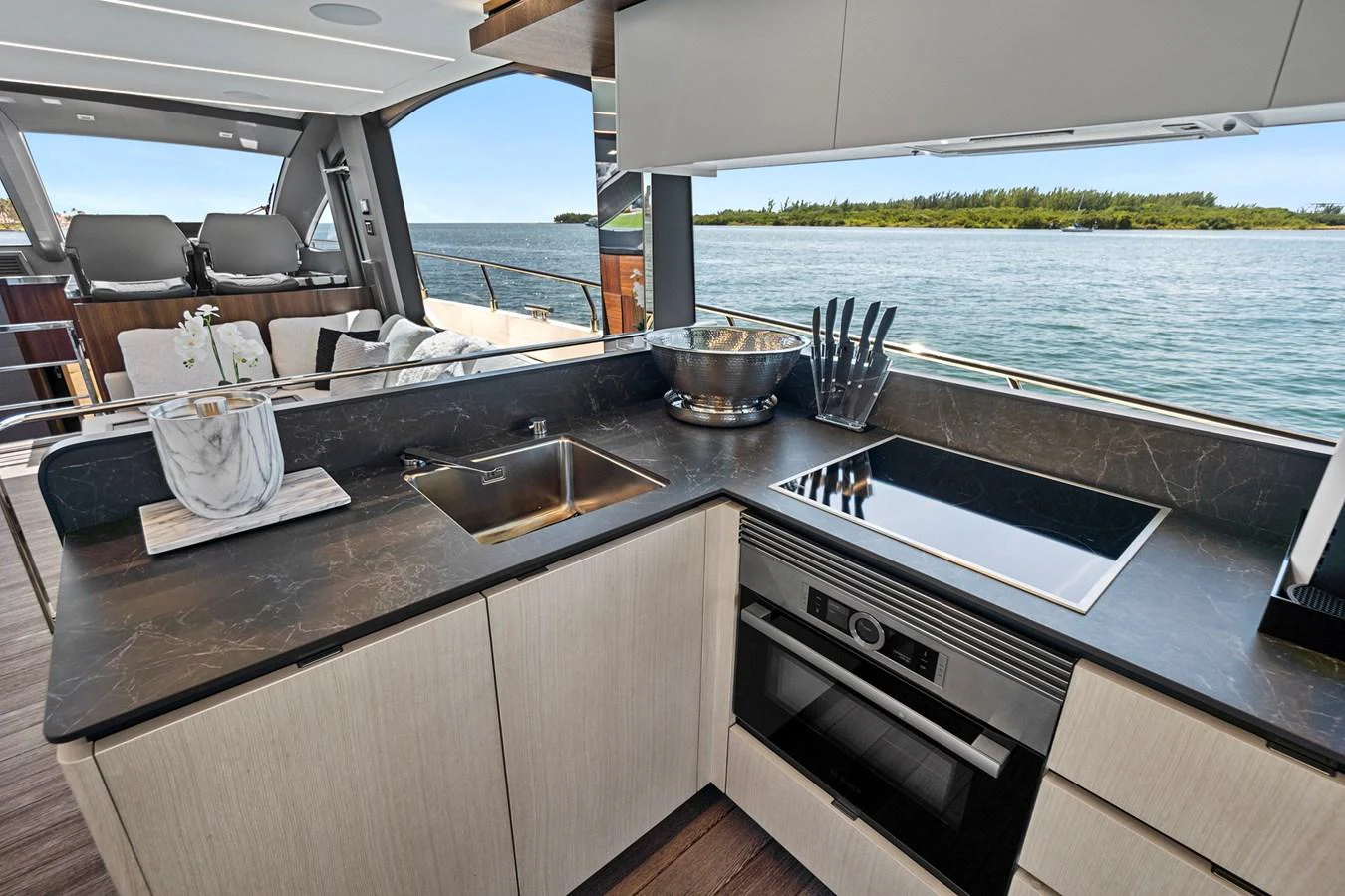 a kitchen with a large window aboard SMILE Yacht for Sale