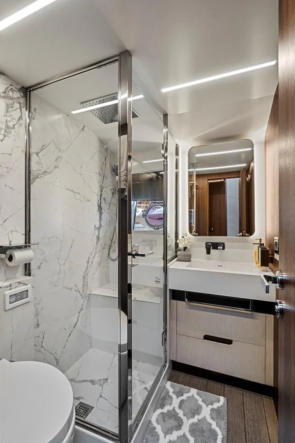 a bathroom with a glass shower aboard SMILE Yacht for Sale
