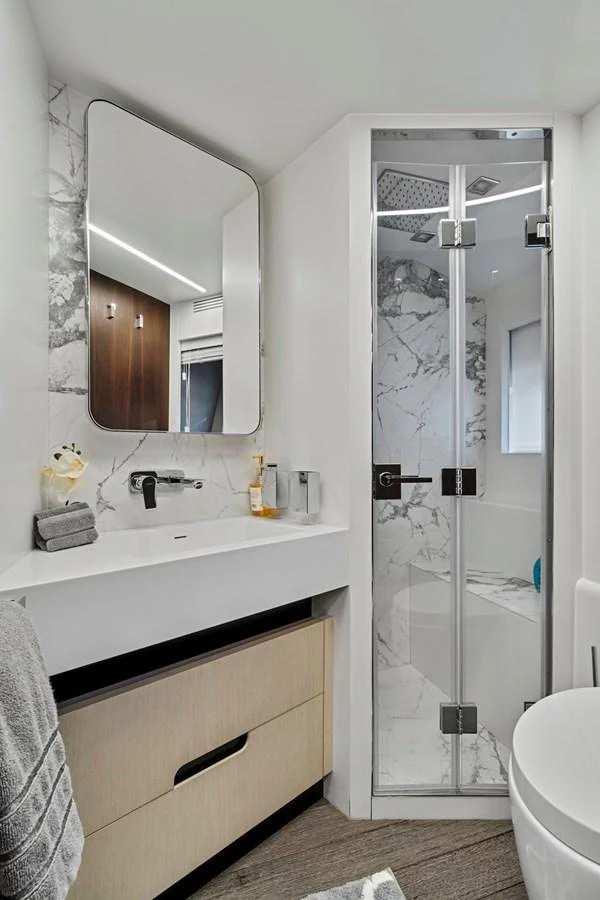 a bathroom with a glass shower aboard SMILE Yacht for Sale