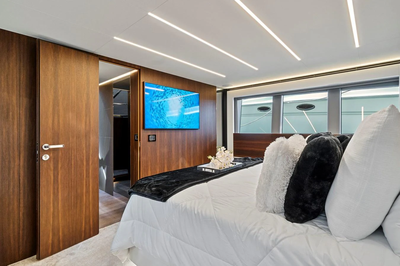 a bed with pillows on it aboard SMILE Yacht for Sale