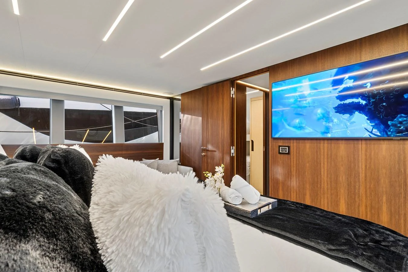 a room with a tv and a bed aboard SMILE Yacht for Sale