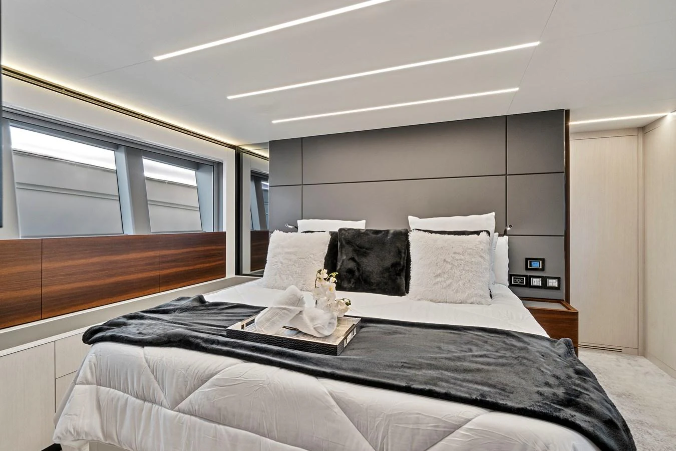 a bed with pillows aboard SMILE Yacht for Sale