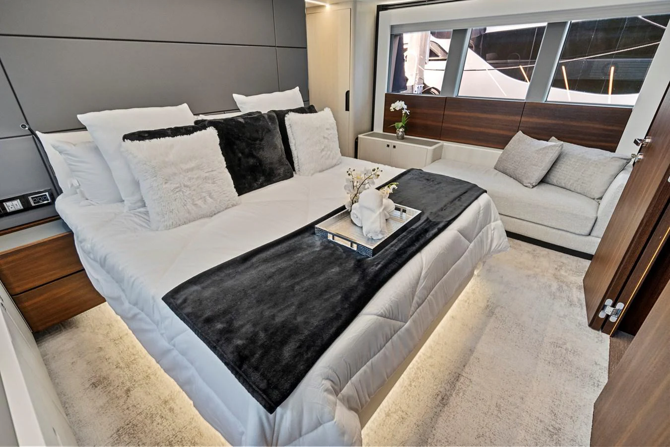a bed with white sheets and pillows aboard SMILE Yacht for Sale