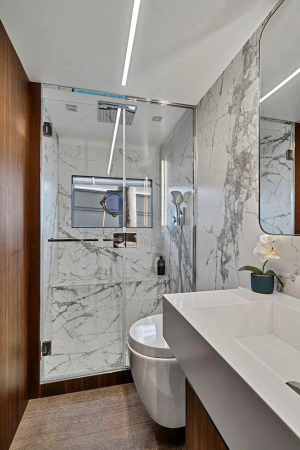 a bathroom with a sink and a toilet aboard SMILE Yacht for Sale