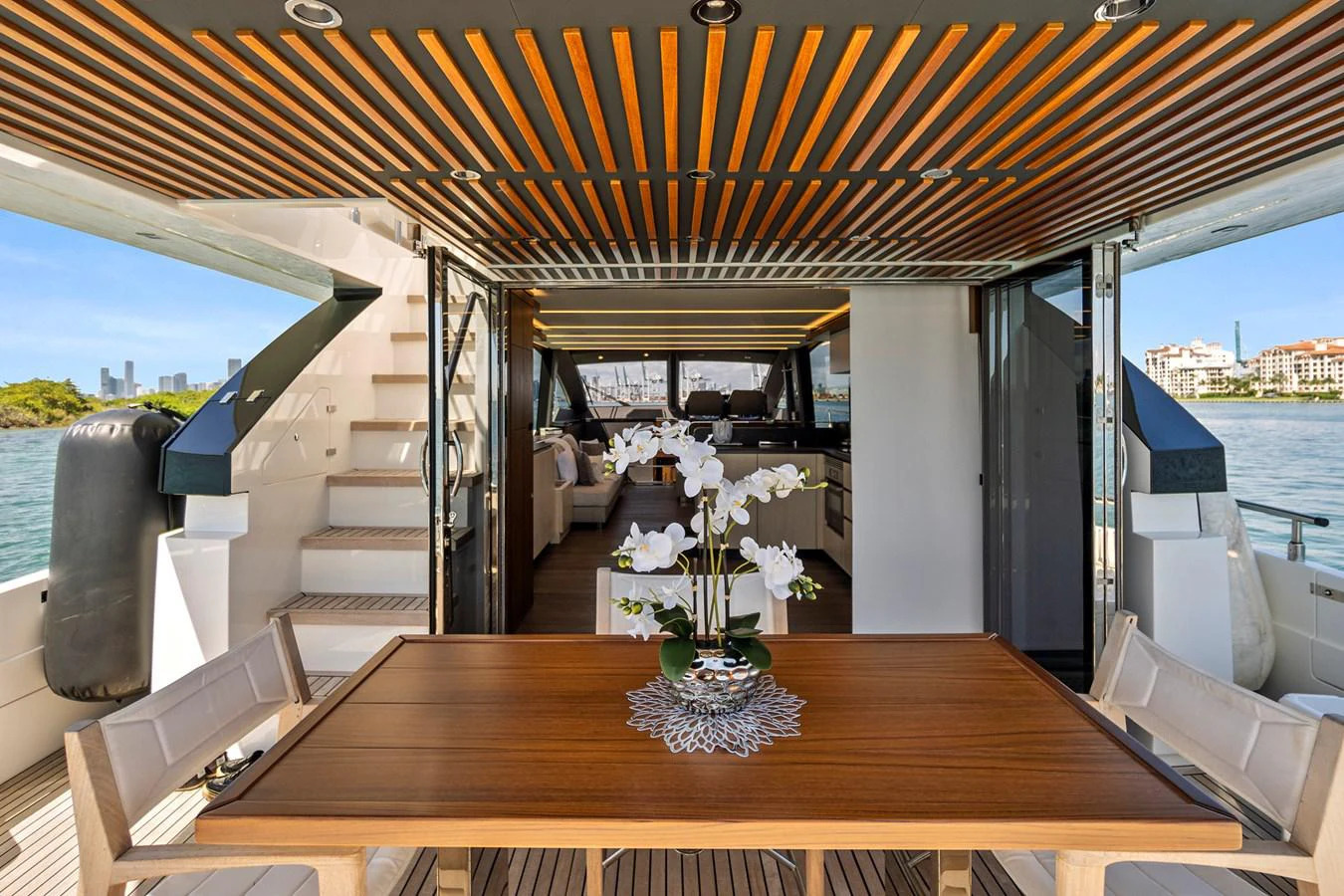 a table with flowers on it aboard SMILE Yacht for Sale