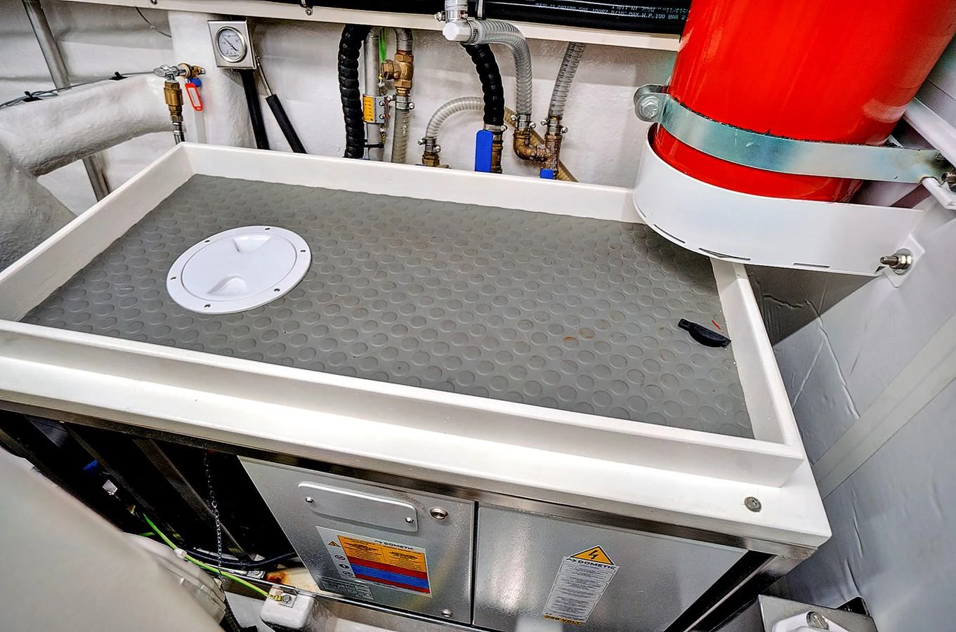 a machine with a red and white label on it aboard SMILE Yacht for Sale
