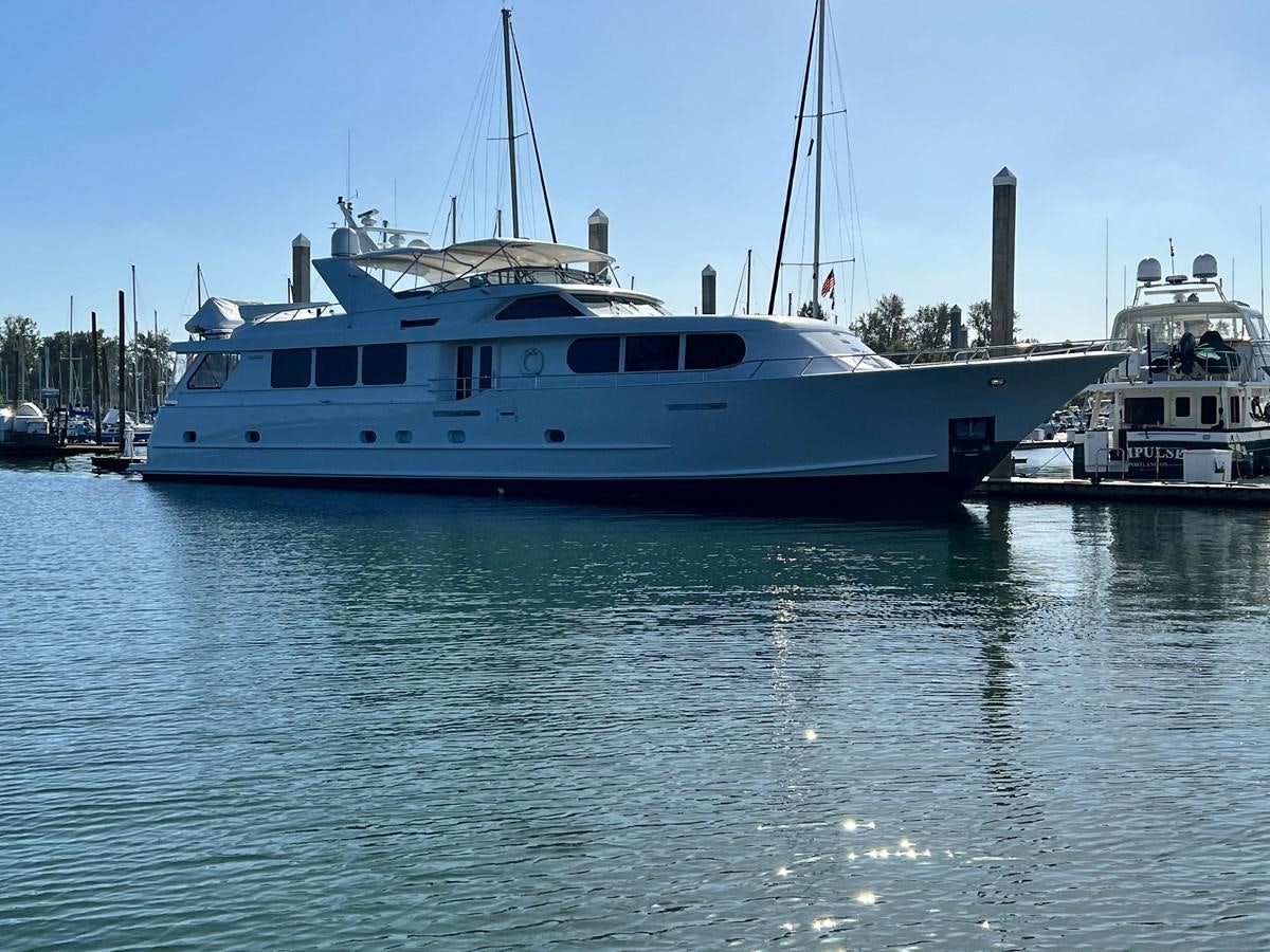 a large white boat in the water aboard 2001 BROWARD RAISED PILOTHOUSE MY Yacht for Sale