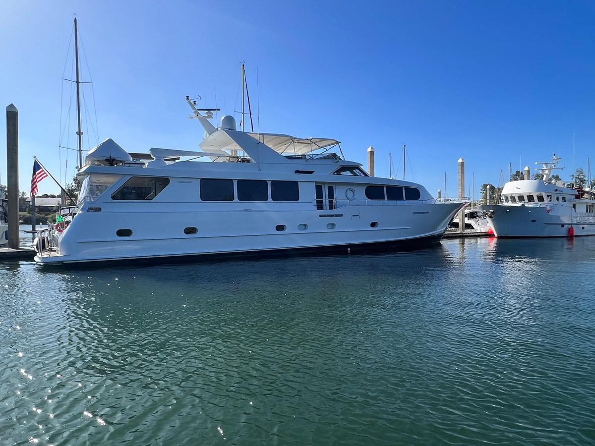 a couple of white boats in the water aboard 2001 BROWARD RAISED PILOTHOUSE MY Yacht for Sale
