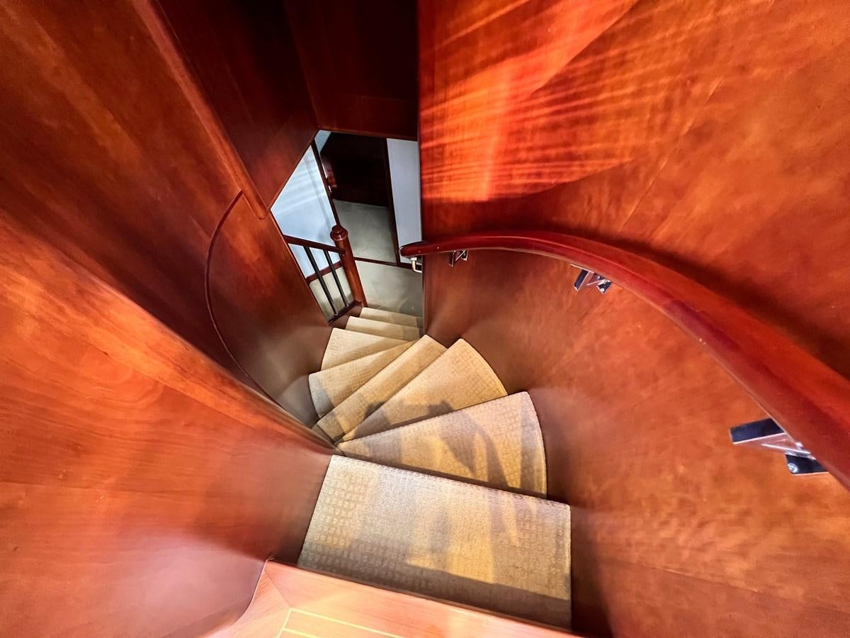 a person lying on a bed aboard 2001 BROWARD RAISED PILOTHOUSE MY Yacht for Sale