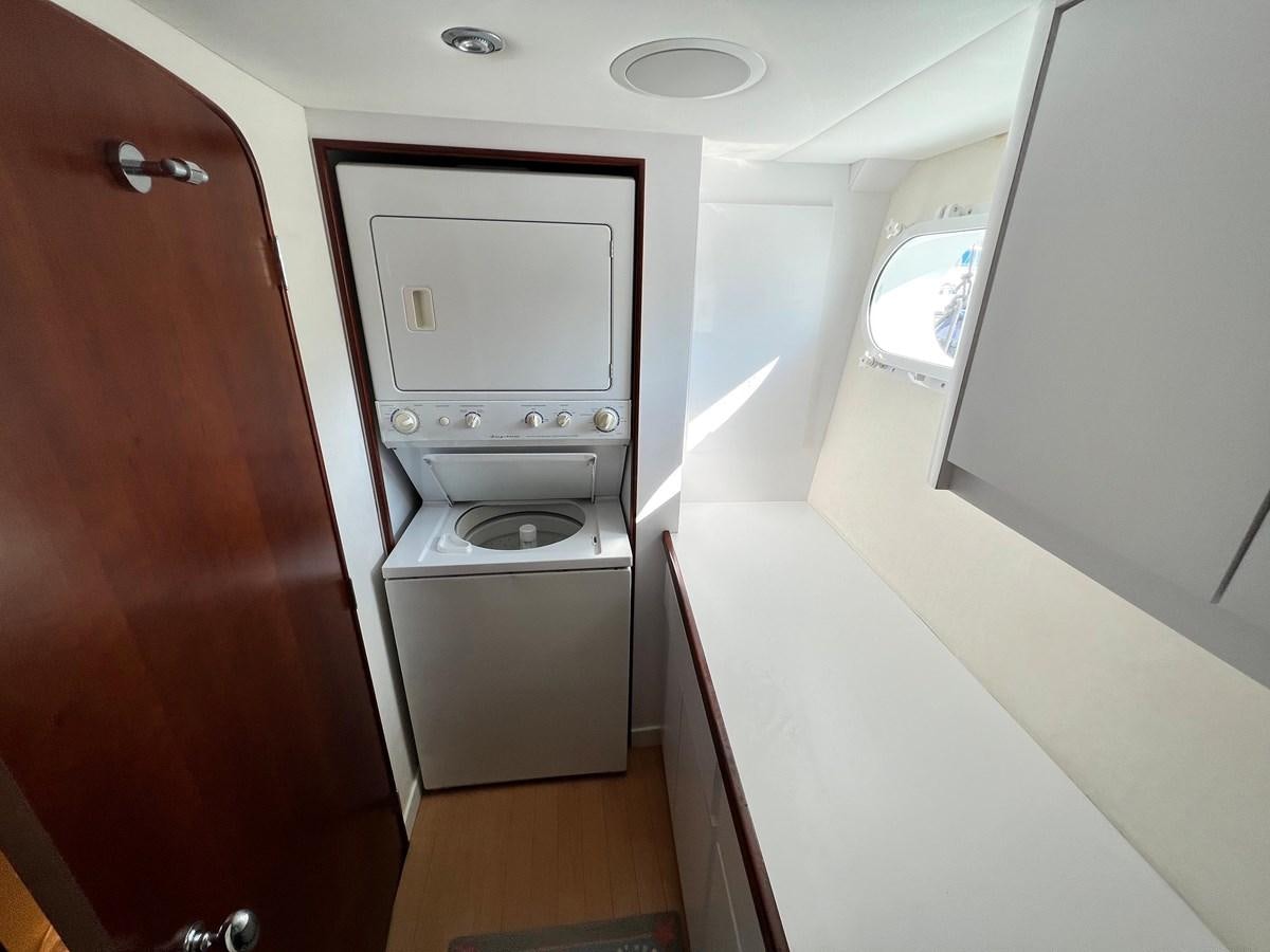 a small room with a machine aboard 2001 BROWARD RAISED PILOTHOUSE MY Yacht for Sale