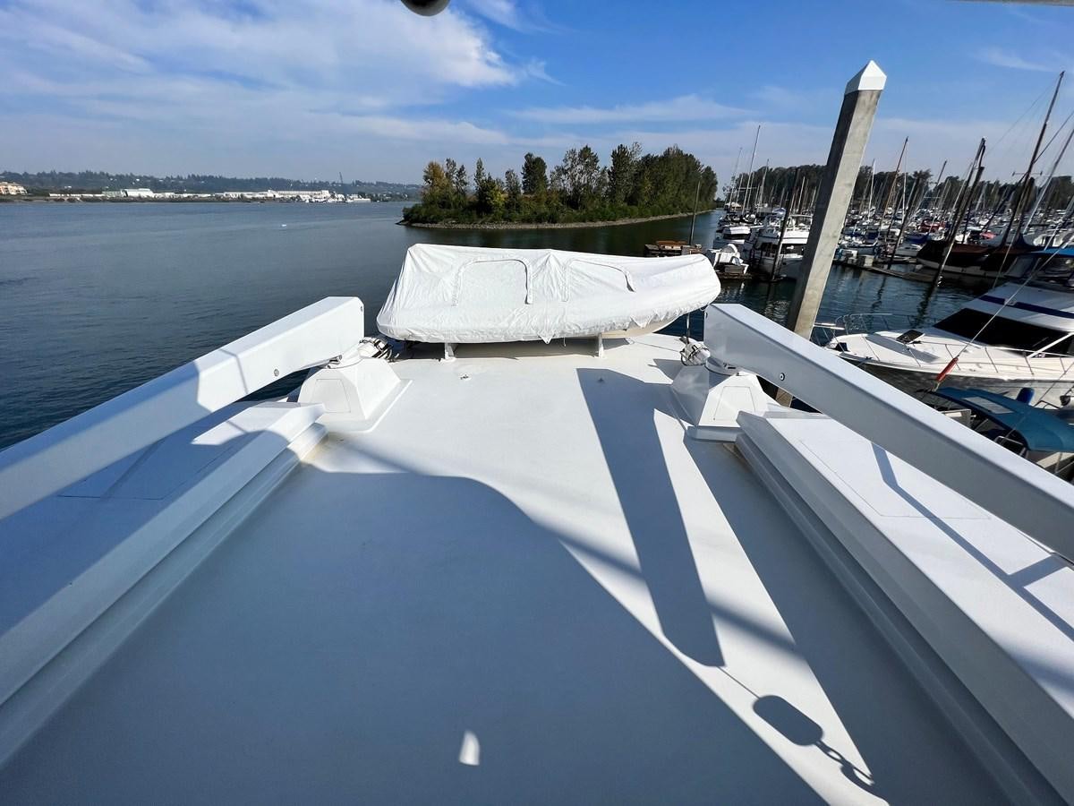 a boat in the water aboard 2001 BROWARD RAISED PILOTHOUSE MY Yacht for Sale