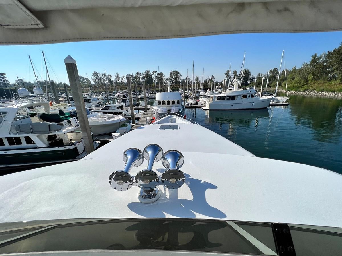 a boat in the water aboard 2001 BROWARD RAISED PILOTHOUSE MY Yacht for Sale
